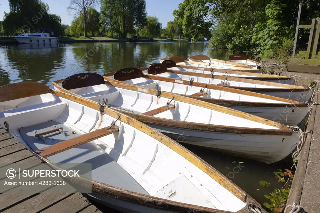 England, Warwickshire, Stratford-upon-Avon. A line of rowing boats for hire, each named after a Shakespearean character.