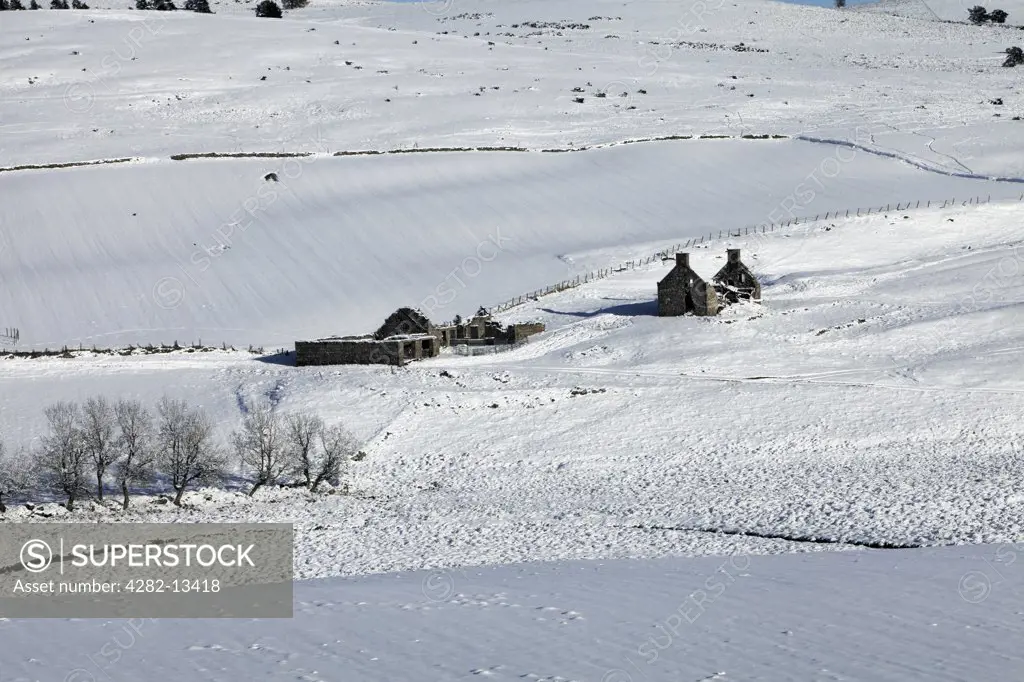 Scotland, Aberdeenshire, Strathdon. Farm Ruins in a snow covered landscape in Glen Deskry.