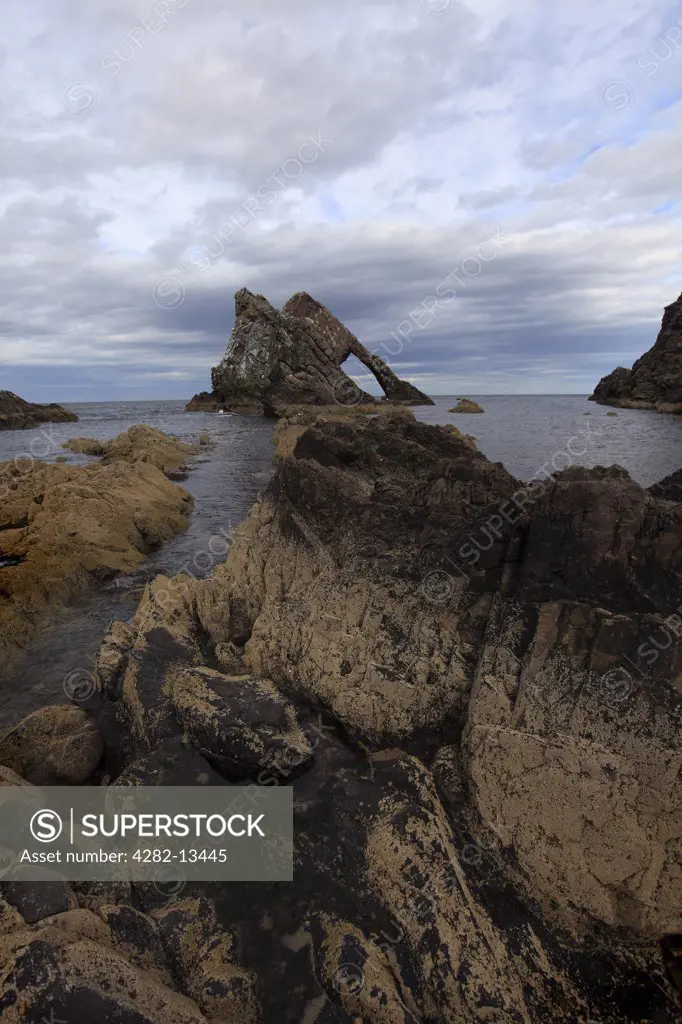Scotland, Banffshire, Portknockie. Bow Fiddle Rock, a large rock just off the coast that resembles the bow of a fiddle.