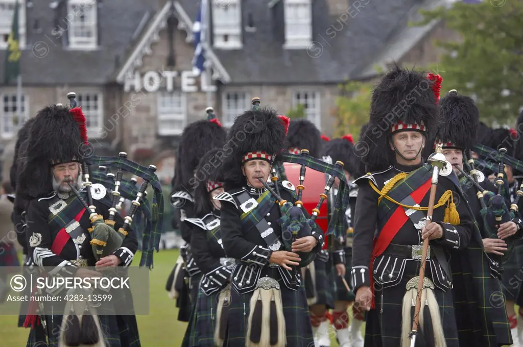 Scotland, Aberdeenshire, Strathdon. Pipers marching at the Lonach Gathering and Highland Games, (billed as Äö?Ñ??Scotland's friendliest Highland GamesÄö?Ñ?¥) held annually in August.