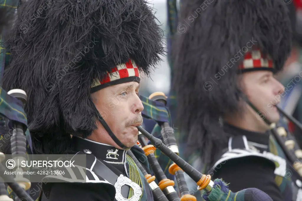 Scotland, Aberdeenshire, Strathdon. Pipers performing at the Lonach Gathering and Highland Games, (billed as ’Scotland’s friendliest Highland Games’) held annually in August.