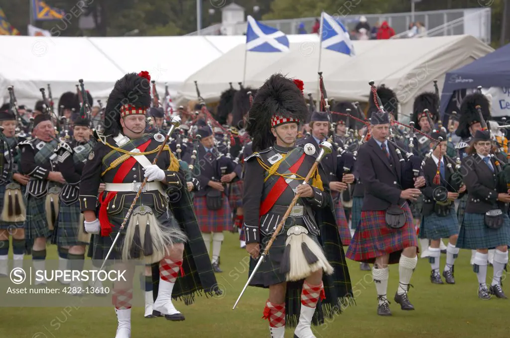 Scotland, Aberdeenshire, Strathdon. Marching pipe bands performing at the Lonach Gathering and Highland Games, (billed as Äö?Ñ??Scotland's friendliest Highland GamesÄö?Ñ?¥) held annually in August.