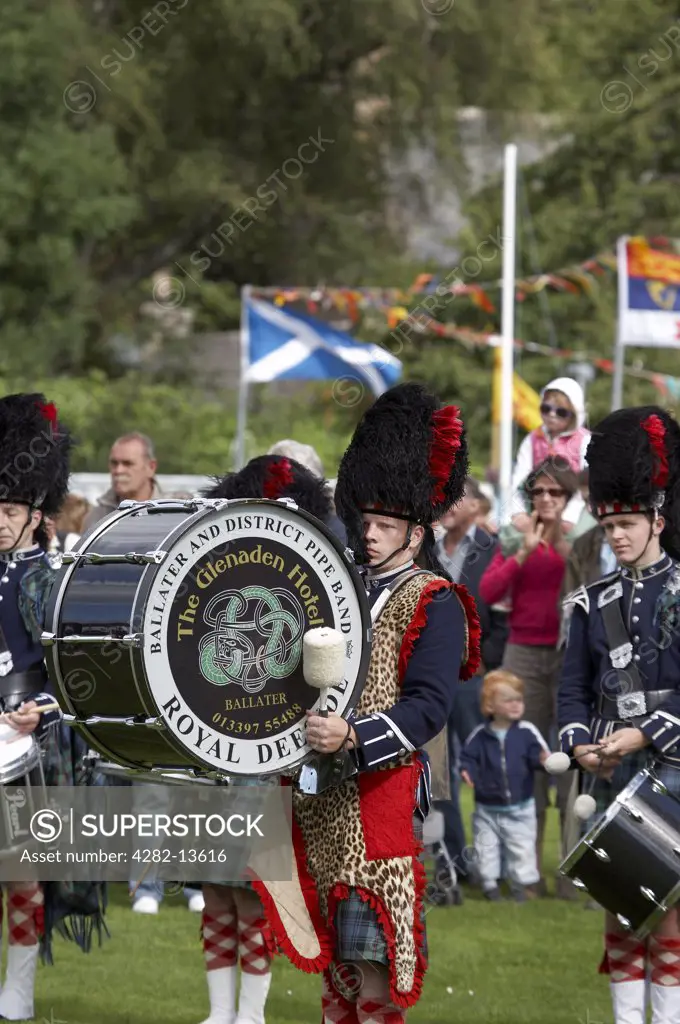 Scotland, Aberdeenshire, Strathdon. A drummer from The Ballater and District Pipe Band performing at the Lonach Gathering and Highland Games, (billed as Äö?Ñ??Scotland's friendliest Highland GamesÄö?Ñ?¥) held annually in August.