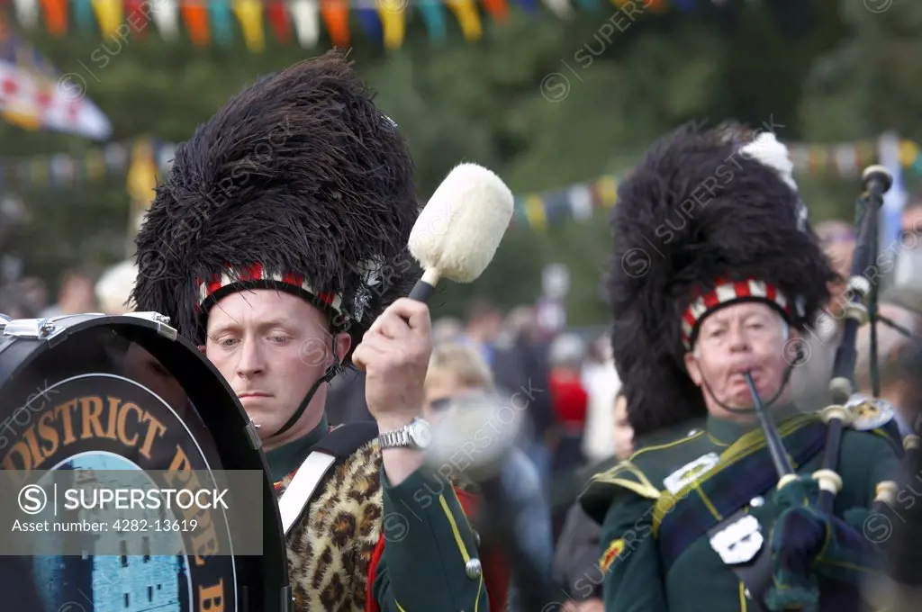 Scotland, Aberdeenshire, Strathdon. A marching pipe band at the Lonach Gathering and Highland Games, (billed as Äö?Ñ??Scotland's friendliest Highland GamesÄö?Ñ?¥) held annually in August.