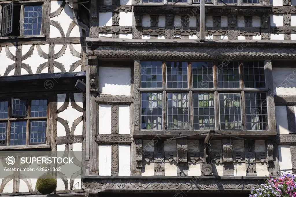 England, Warwickshire, Stratford-upon-Avon. A close-up of the timber framing of the Garrick Inn and Harvard House in the main high street of Stratford-upon-Avon.