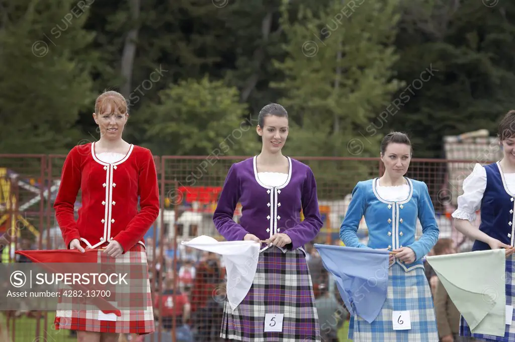Scotland, Aberdeenshire, Strathdon. A line of finalists in the Highland Dancing competition at the Lonach Gathering and Highland Games.