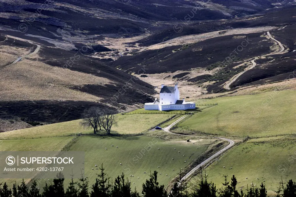 Scotland, Aberdeenshire, Corgarff. A view over fields to the castle at Corgarff.