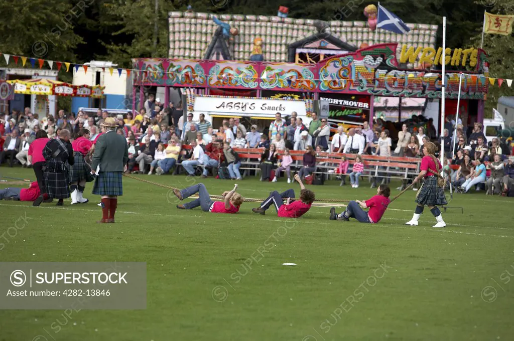 Scotland, Aberdeenshire, Strathdon. A tug of war competition at the Lonach Highland Games.