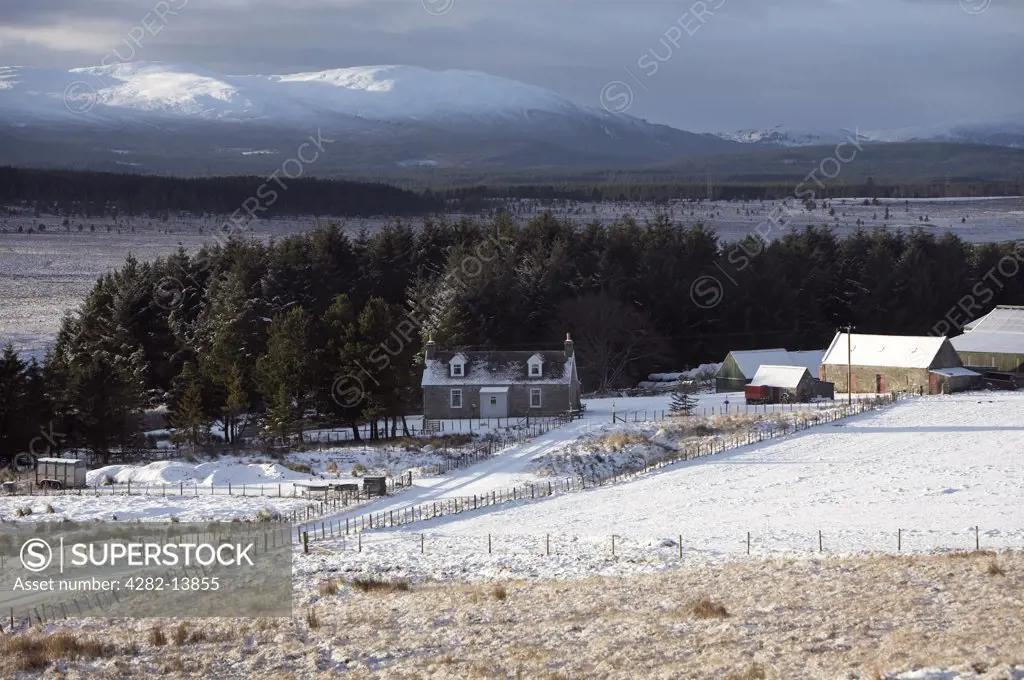 Scotland, Strathspey, Cairngorms. A view to a farm, mountains and the Braes of Abernethy.