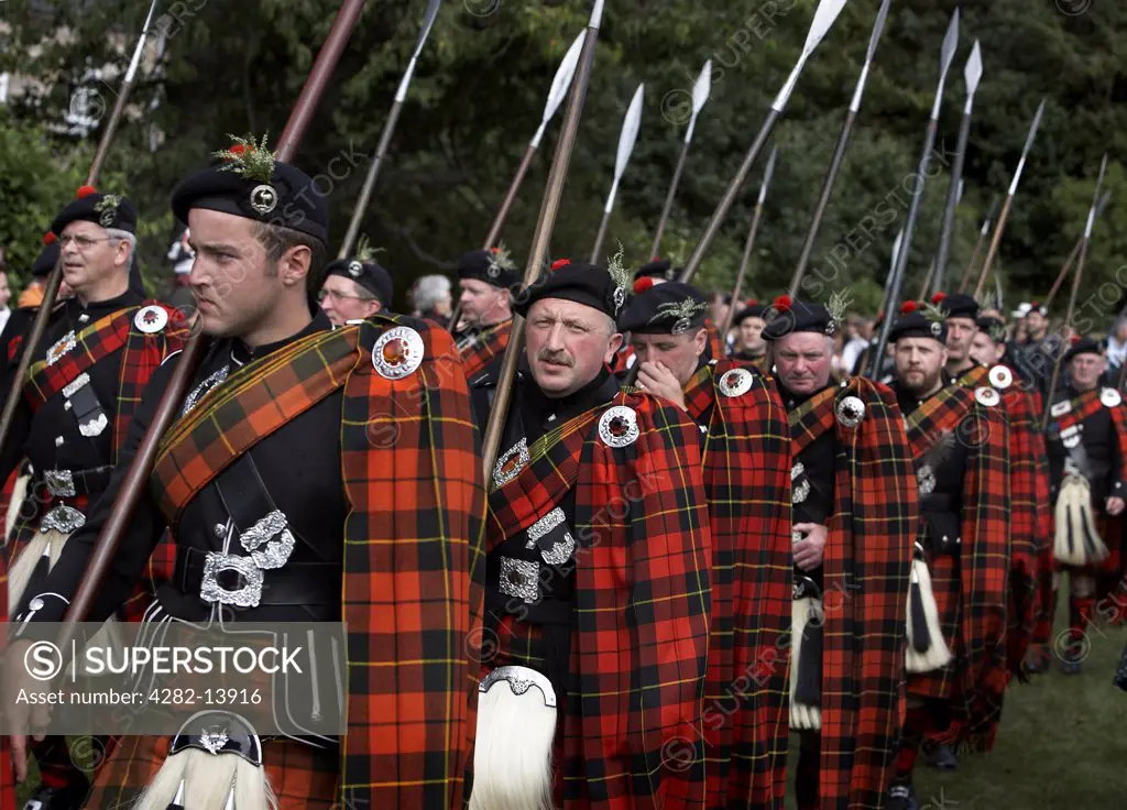 Scotland, Aberdeenshire, Strathdon. The Wallace Highlanders in traditional costume at the Lonach Highland Games.