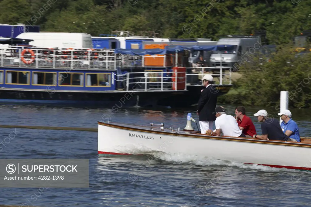 England, Oxfordshire, Henley-on-Thames. An umpire following a race at the annual Henley Royal Regatta.