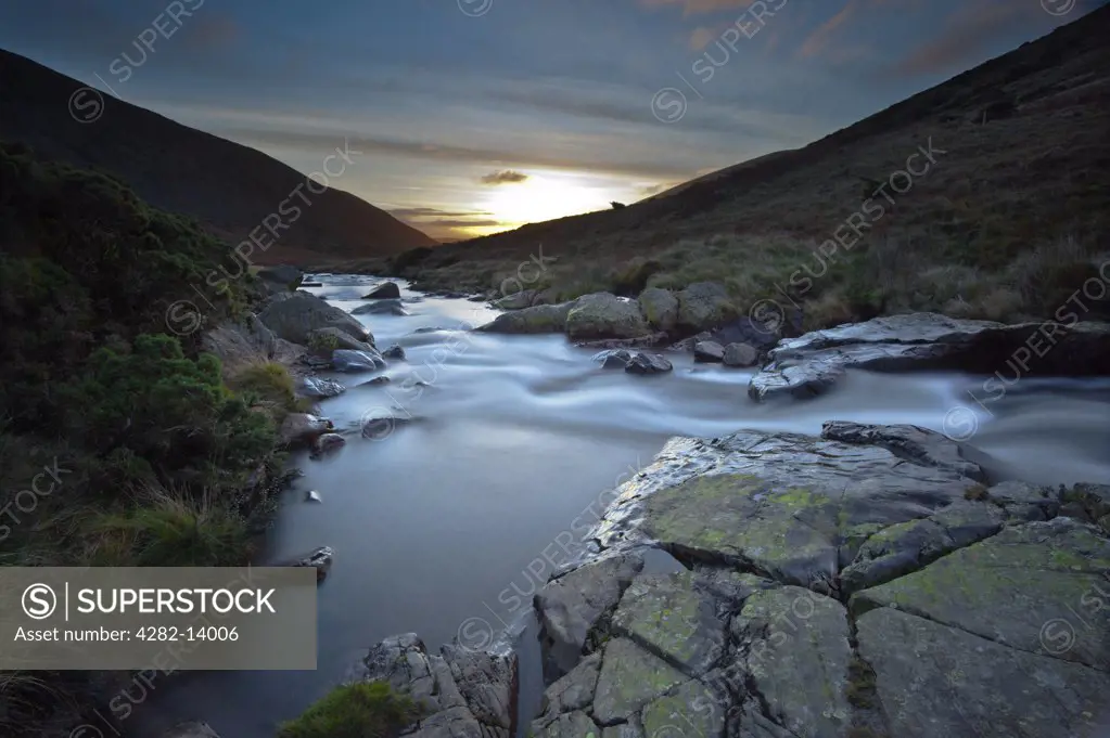 England, Cumbria, Mosedale. Sunrise over the River Caldew in the Lake District National Park.