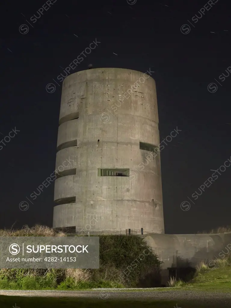 England, Channel Islands, Guernsey. A night time view of a World War Two German rangefinder bunker on Guernsey.