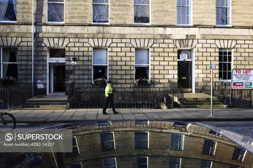 Scotland, City of Edinburgh, Edinburgh. Buildings in Abercromby Place reflected in the roof of a car.