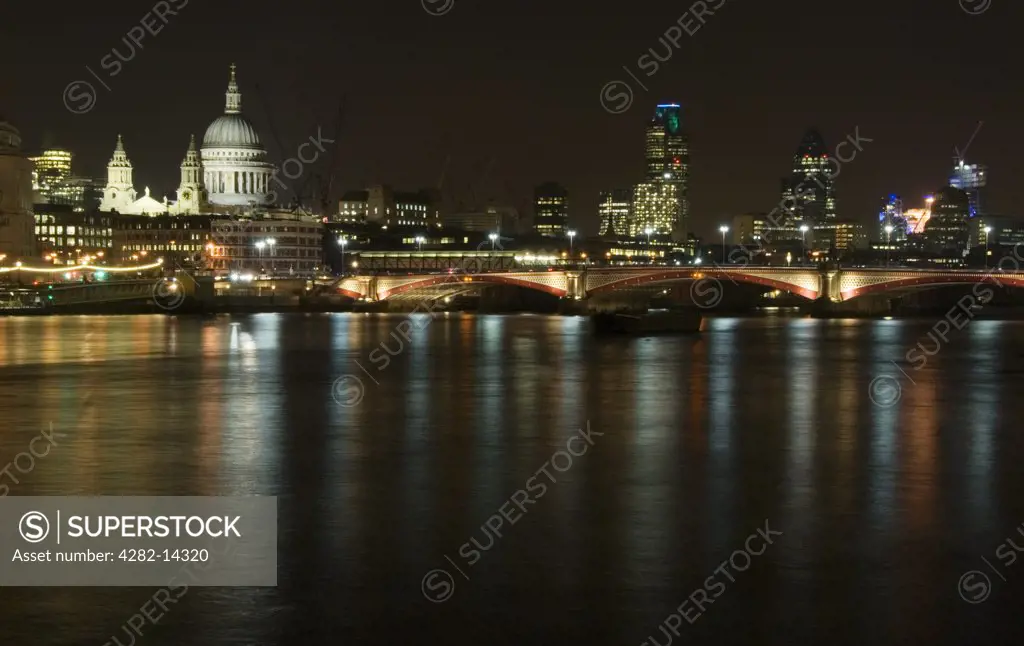 England, London, St Paul's Cathedral. St Paul's Cathedral and the River Thames at night. As the 300th anniversary of the completion of St Paul's approaches, the Cathedral is undergoing an historic ¬¨¬£40 million restoration campaign.