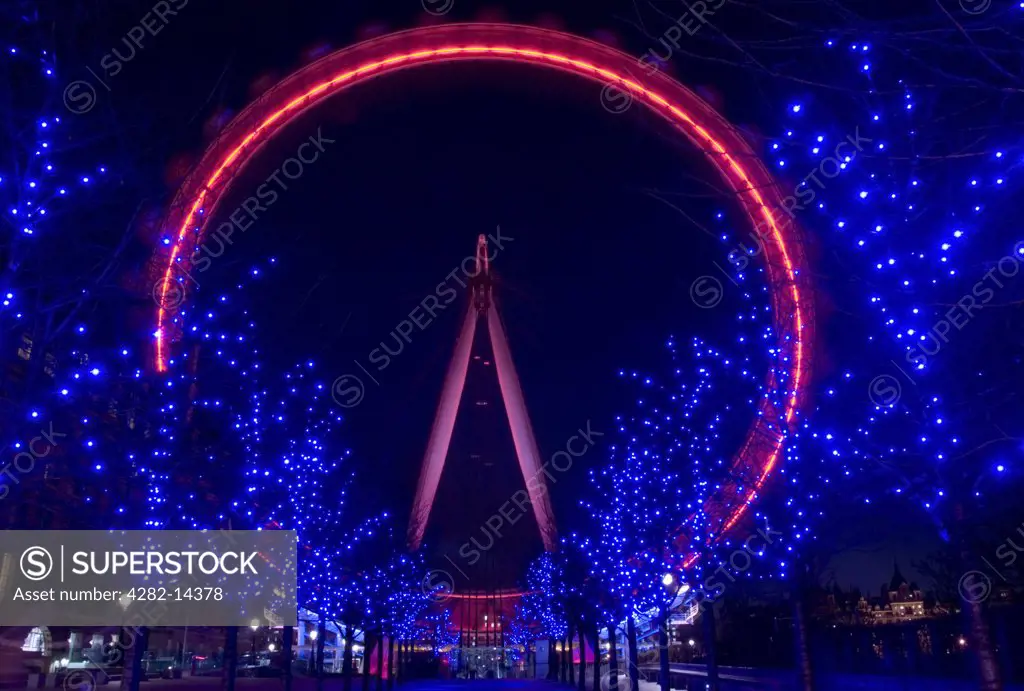England, London, South Bank. The London Eye viewed at night from the South Bank.
