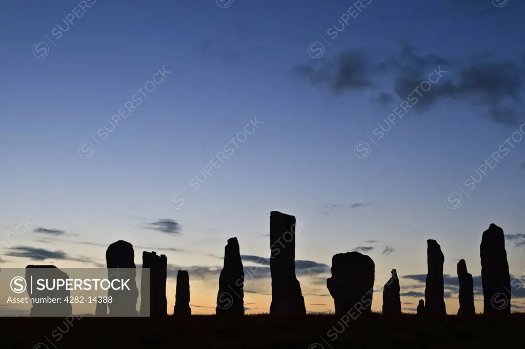Scotland, Isle of Lewis, Callanish Outer Hebrides. A silhouette of the ancient standing stones of Callanish 1 in the Isle of Lewis.