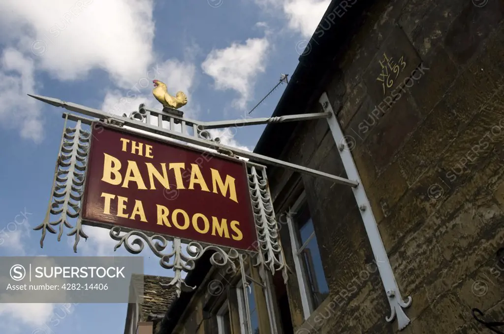 England, Gloucestershire, Chipping Camden. Looking up at a traditional tea room sign in the streets of Chipping Camden.