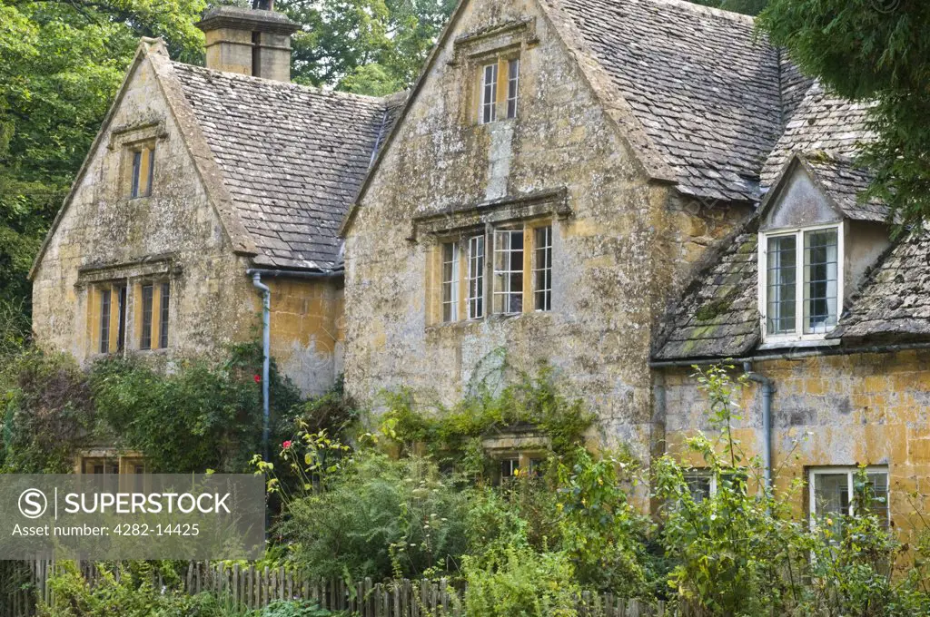 England, Gloucestershire, Bibury. A traditional Cotswold cottage in the picturesque village of Bibury.