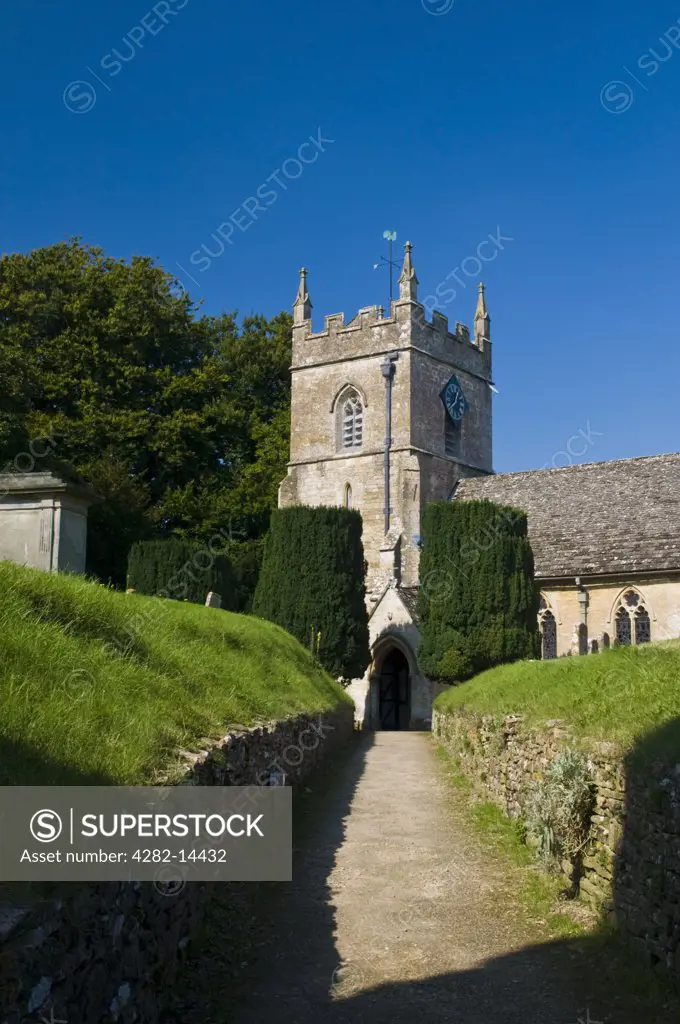 England, Gloucestershire, Upper Slaughter. Path leading to the Norman church of St Peters in the village of Upper Slaughter.