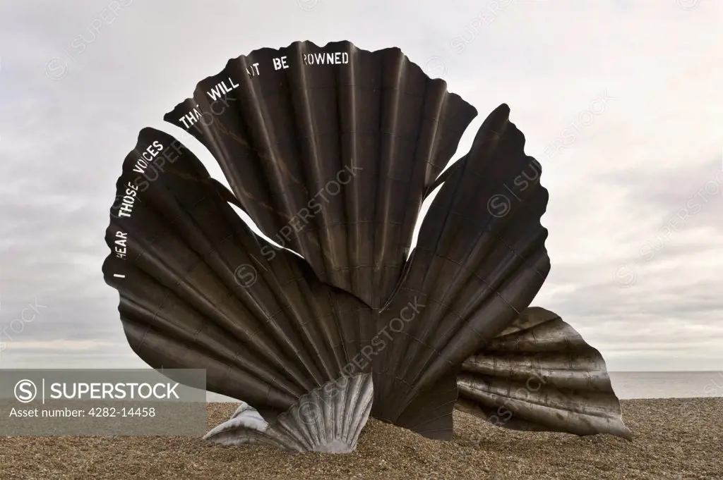 England, Suffolk, Aldeburgh. The Scallop sculpture by Maggie Hambling on the beach at Aldeburgh.