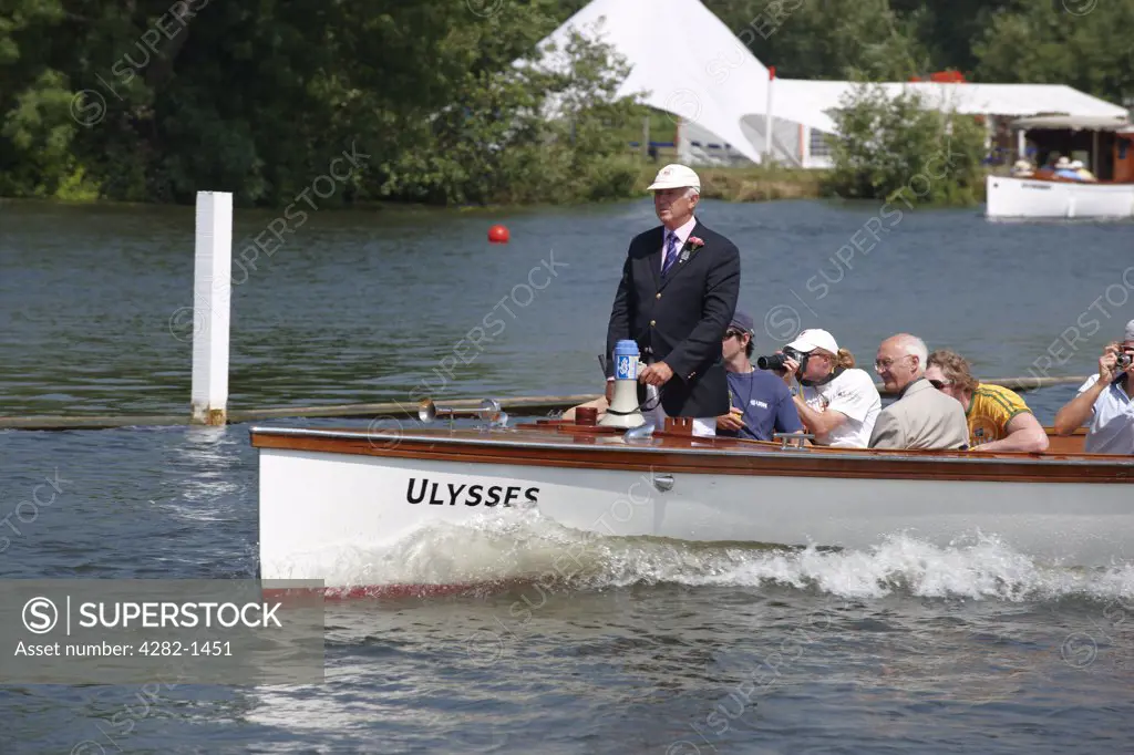 England, Oxfordshire, Henley-on-Thames. An umpire following a race at the annual Henley Royal Regatta.