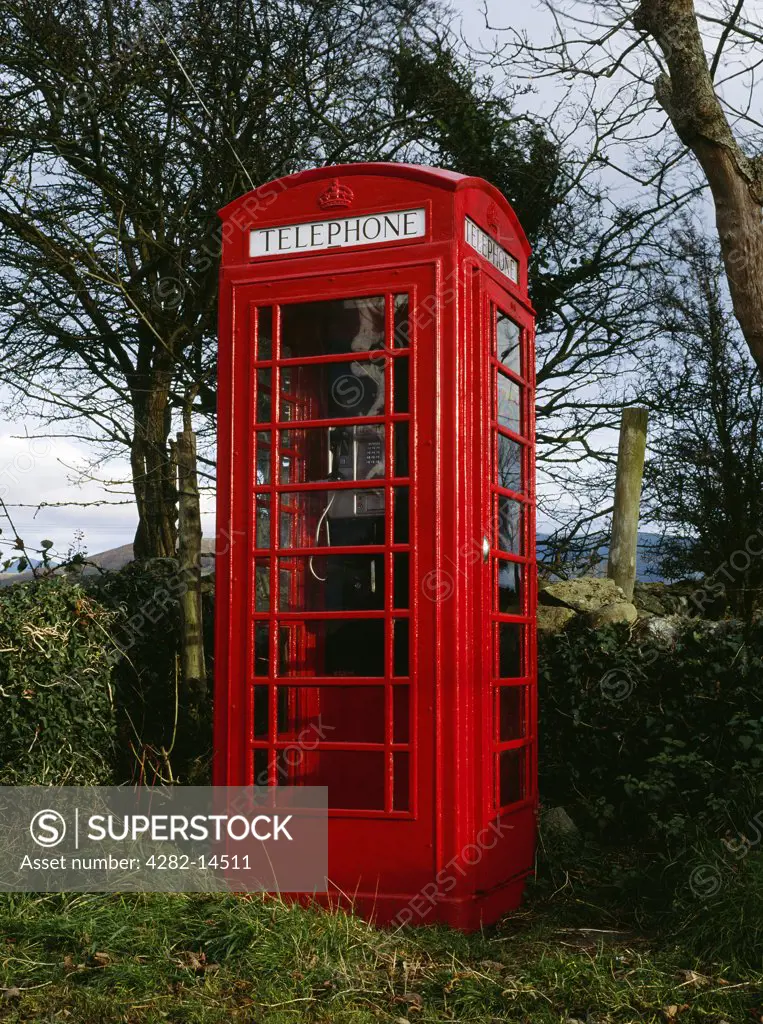 Wales, Gwynedd, Penisarwaun. A traditional red telephone box - a K6 kiosk designed by Sir Giles Gilbert Scott to commemorate the Silver Jubilee of King George V in 1935.