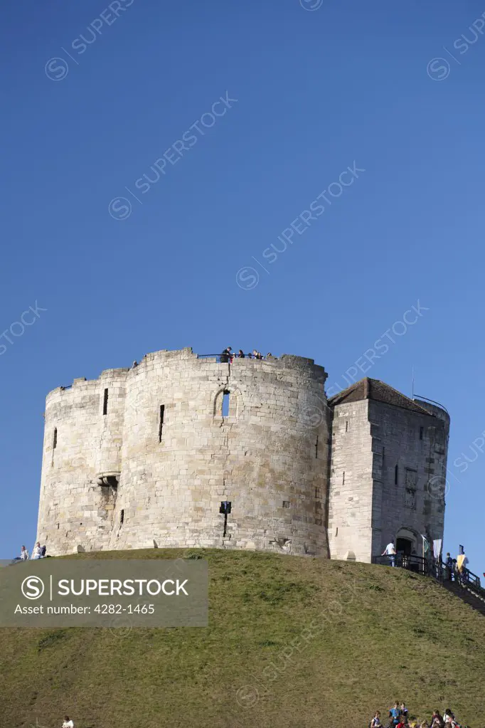 England, North Yorkshire, York. Clifford's Tower, the stone keep of York castle named after Sir Roger Clifford who was executed there in 1322.