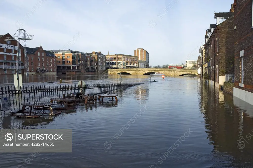 England, North Yorkshire, York. View of King's Staith and Ouse Bridge in York with the River Ouse in flood.