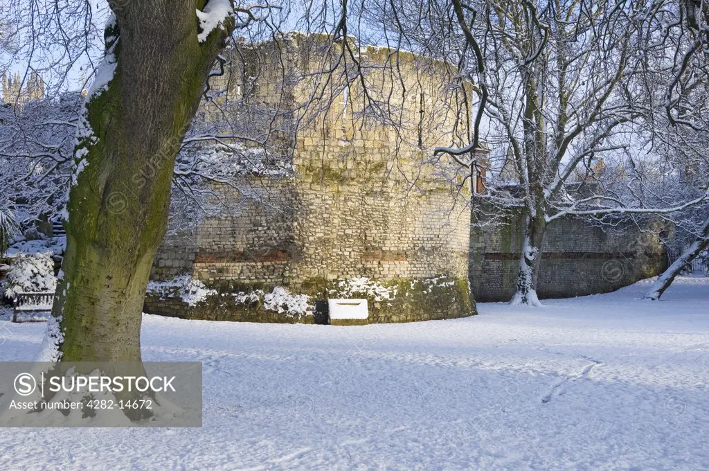 England, North Yorkshire, York. Snow covering the Roman-built Multangular Tower in the Yorkshire Museum Gardens in the centre of York.