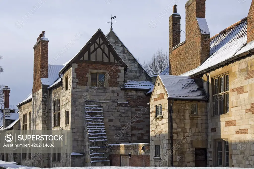 England, North Yorkshire, York. Snow covering the roof of King's Manor, a group of largely Grade I medieval buildings, now home to the staff and students of the University of York.