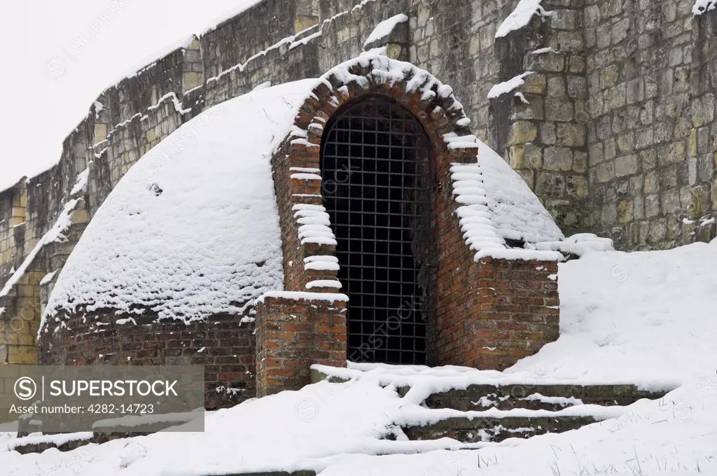 England, North Yorkshire, York. The ice house covered in snow. The igloo-shaped building adjacent to the York city walls at Monk Bar was built around 1800 to store ice for use in the summer.