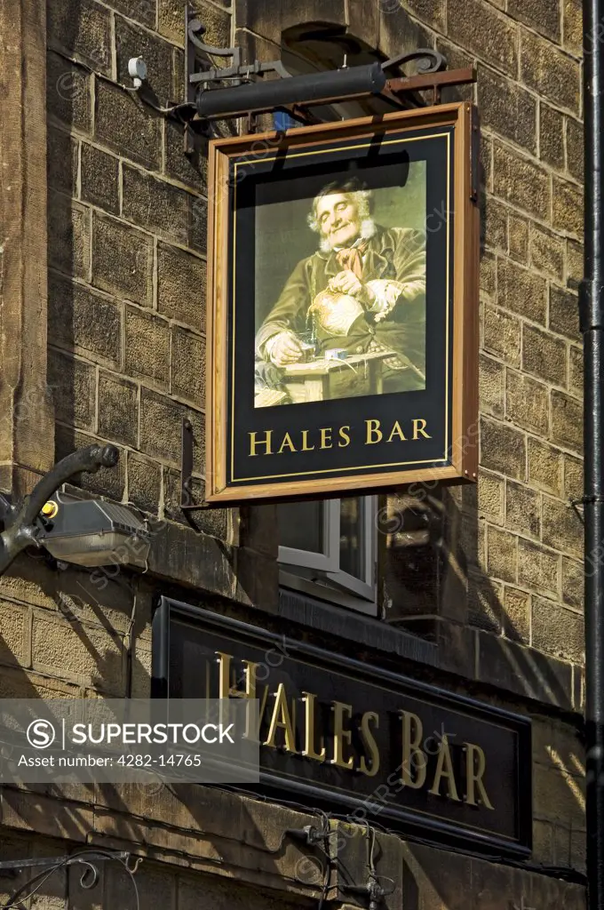 England, North Yorkshire, Harrogate. Hanging sign above the entrance to Hales Bar, Harrogate's only traditional gas-lit bar.