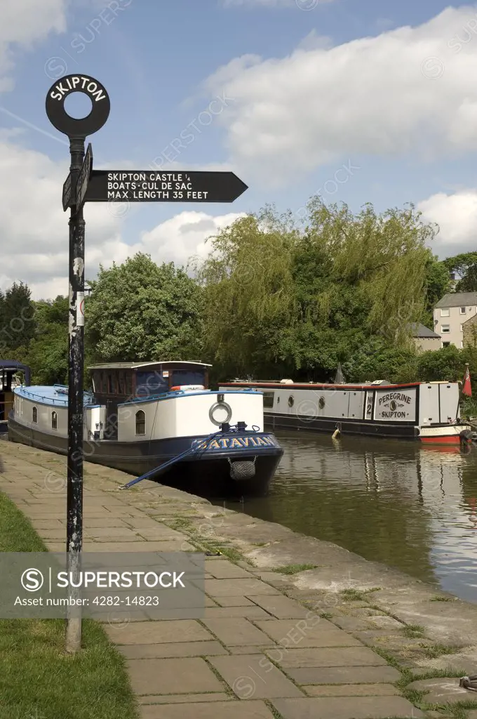 England, North Yorkshire, Skipton. Canal boats moored on Leeds Liverpool Canal Skipton.