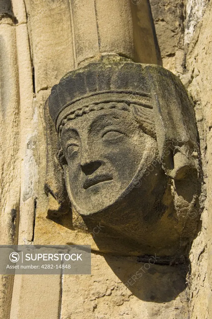 England, East Riding of Yorkshire, Bridlington. Carving of woman's face on the wall of Bridlington Priory Church (St Mary).