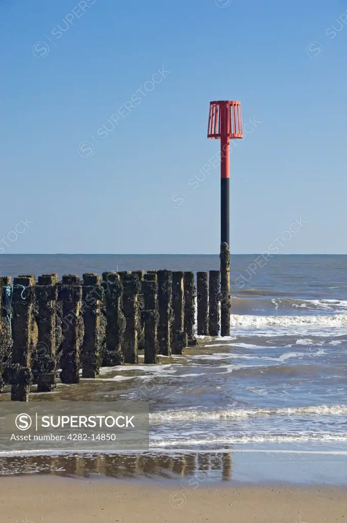 England, East Riding of Yorkshire, Bridlington. Warning mast on the beach.