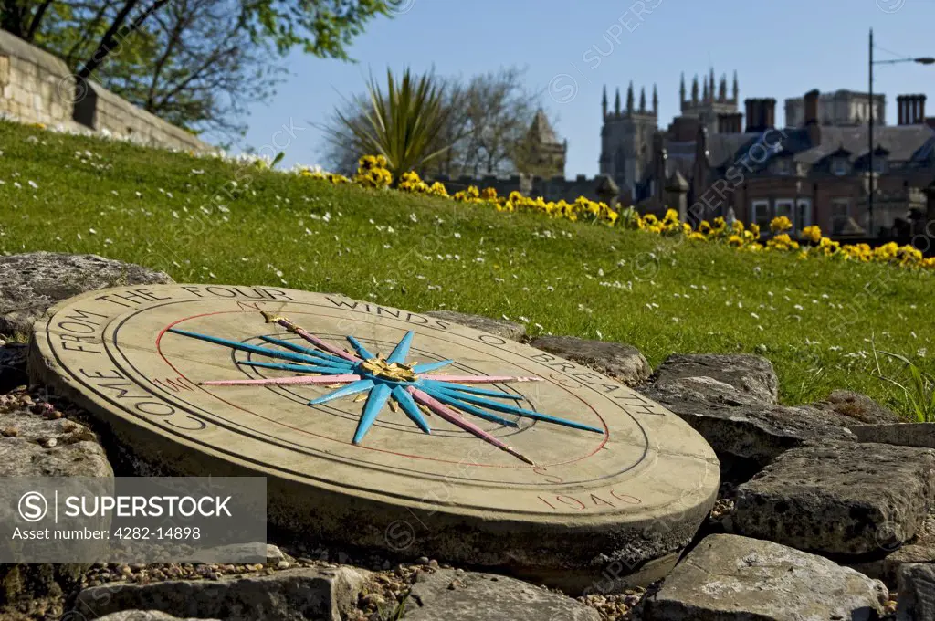England, North Yorkshire, York. Stone compass adjacent to the City Walls.