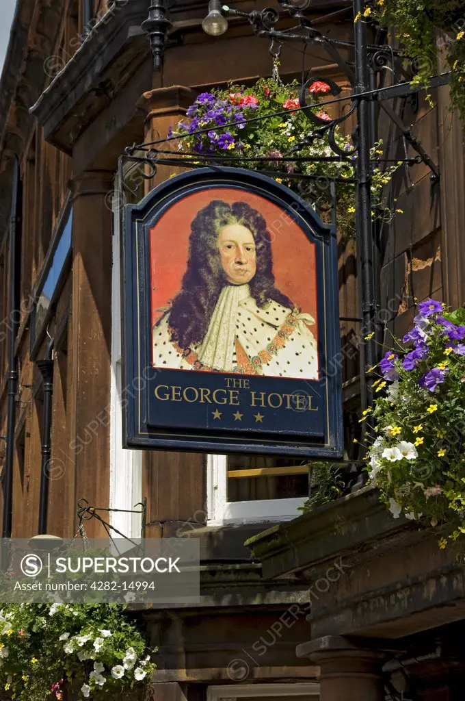 England, Cumbria, Penrith. Sign hanging outside The George Hotel.