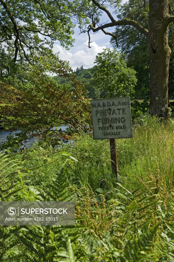 England, Cumbria, near Ambleside. Private fishing sign on the banks of the River Rothay near Ambleside.