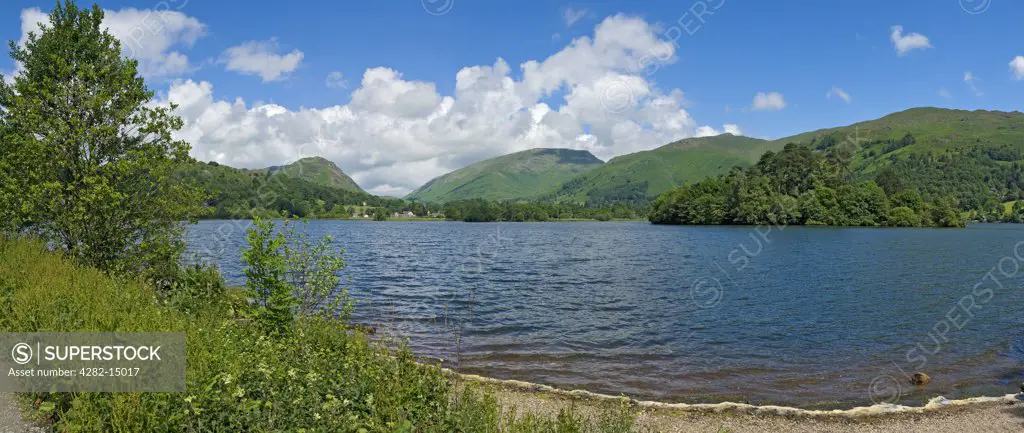 England, Cumbria, Grasmere. Panoramic view looking across Grasmere towards Helm Crag and Fairfield in the Lake District.