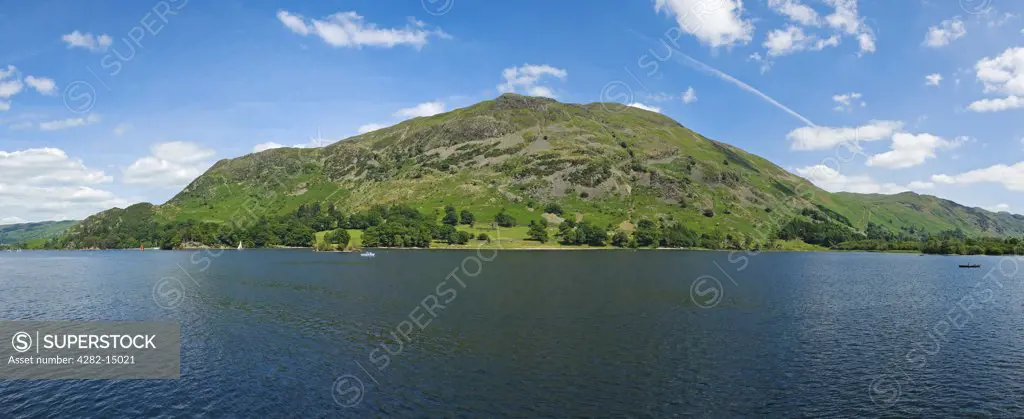 England, Cumbria, Ullswater. Panoramic view looking across Ullswater towards Place Fell in the Lake District.