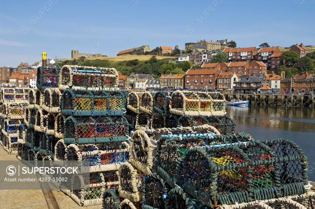 England, North Yorkshire, Whitby. Crab pots stacked on the quayside.
