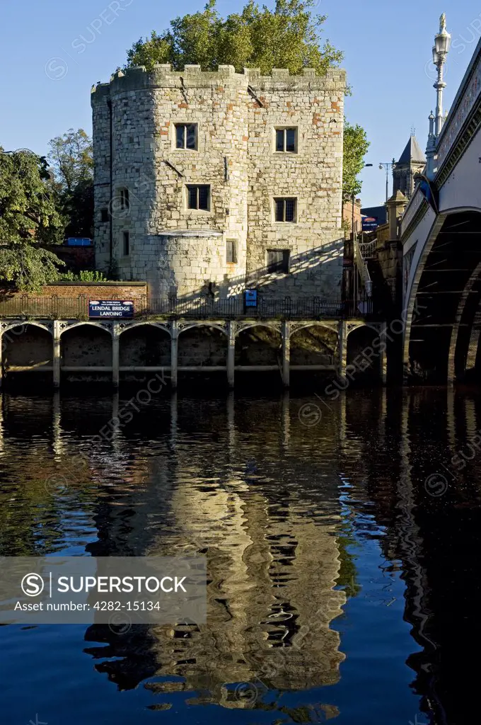 England, North Yorkshire, York. Lendal Tower by Lendal Bridge over the River Ouse.