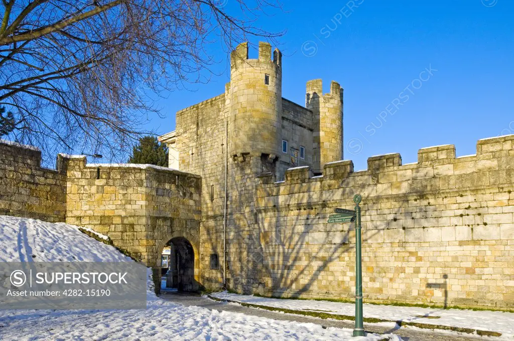 England, North Yorkshire, York. Walmgate Bar, the most complete of the four main medieval gateways to the city, and City Walls in winter.
