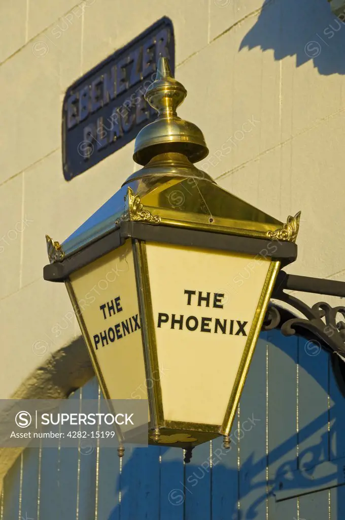England, North Yorkshire, York. Brass lamp hanging outside The Phoenix pub in Ebenezer Place.