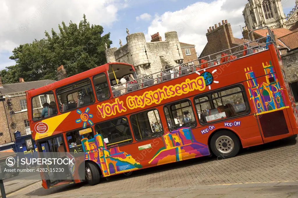 England, North Yorkshire, York. York City sightseeing tour bus stopping at Exhibition Square.
