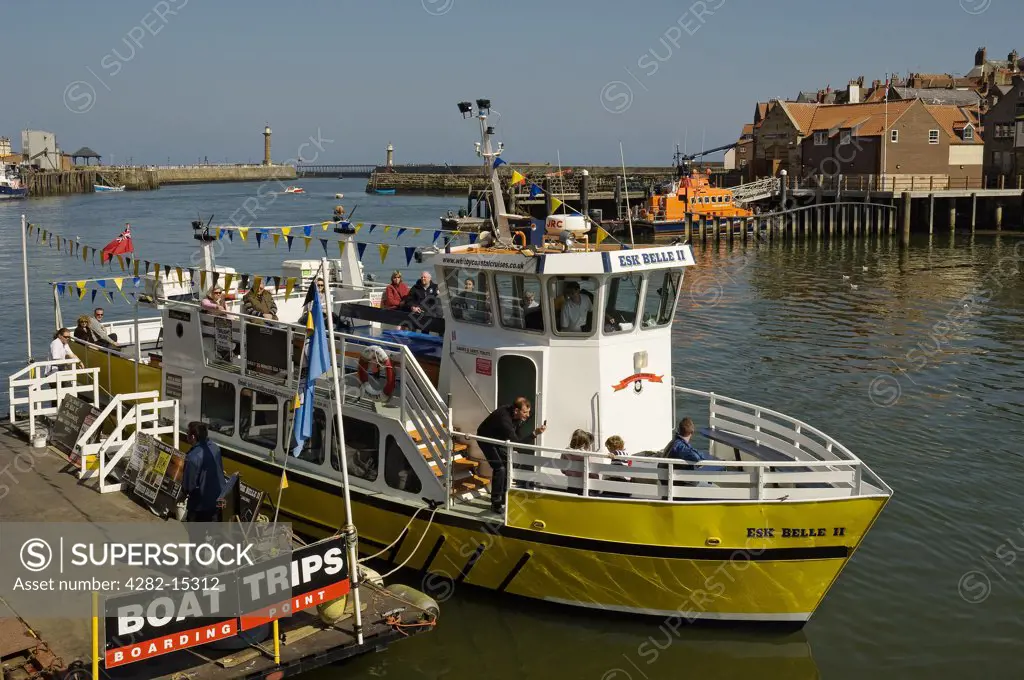 England, North Yorkshire, Whitby. A pleasure boat moored in Whitby Harbour.
