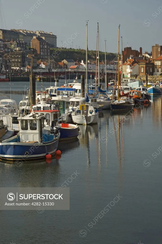 England, North Yorkshire, Whitby. Boats moored in Whitby Harbour.