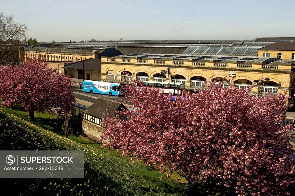 England, North Yorkshire, York. Exterior of York Railway Station in spring, viewed from the City Walls.
