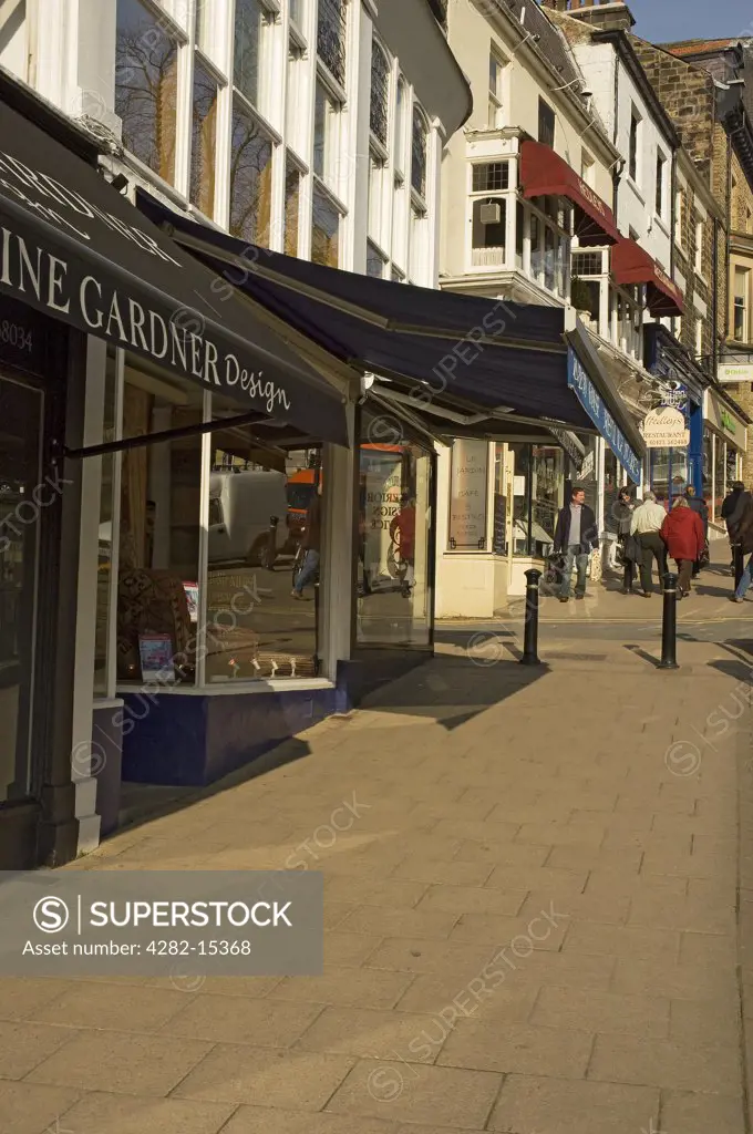 England, North Yorkshire, Harrogate. A row of shops on Montpellier Parade.